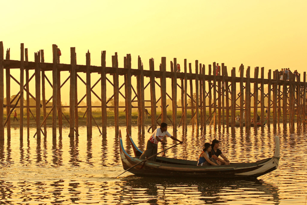 Myanmar Mandalay U Bein Bridge boat at sunset